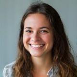 Portrait of Amélie Dubois, a smiling program graduate from Lyon.
